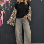 Black top with zebra-print sleeves